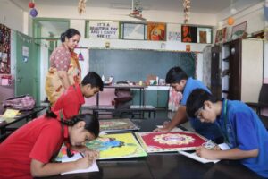 Students creating artwork in the classroom at Chaitanya School, the Best CBSE School Near Me.