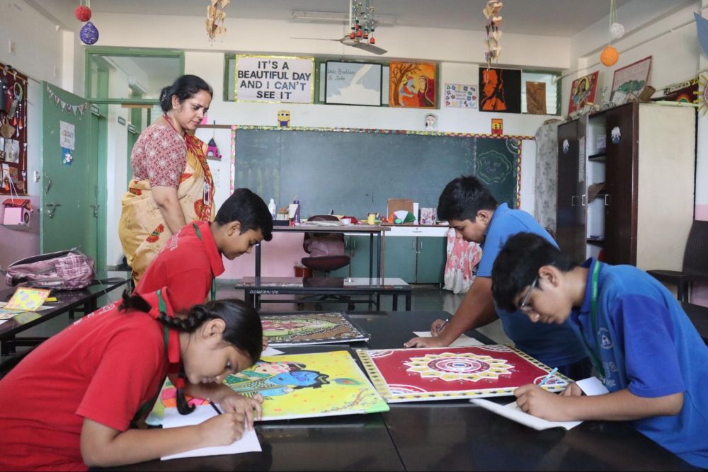 Students creating artwork in the classroom at Chaitanya School, the Best CBSE School Near Me.