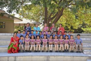 Group photo of students and teachers at Chaitanya School, one of the top 5 CBSE schools in Gandhinagar.