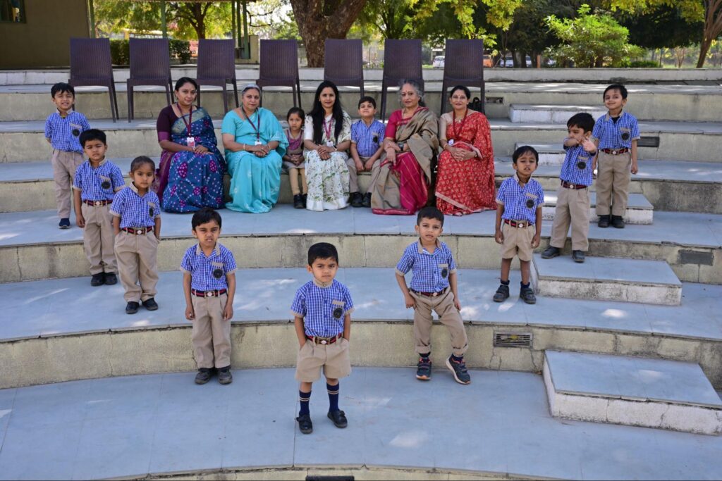 Students and faculty posing outdoors at Chaitanya School, ranked among the top 5 CBSE schools in Gandhinagar.