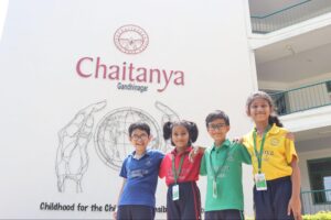 Young learners standing together at Chaitanya School - Best School In Gandhinagar