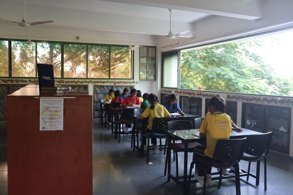 Students studying in library at Chaitanya Best School in Gandhinagar – CBSE School in Gandhinagar with modern learning environment 
