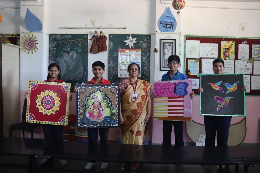 Young artists presenting their artwork at one of the best schools in Gandhinagar, celebrating creativity and expression.